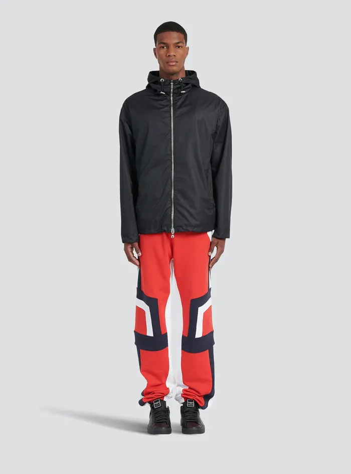 Balmain Outerwear Mens Hooded Nylon Windbreaker With Transparent Balmain Logo Black Balmain Outerwear Mens Hooded Nylon Windbreaker With Transparent Balmain Logo Black