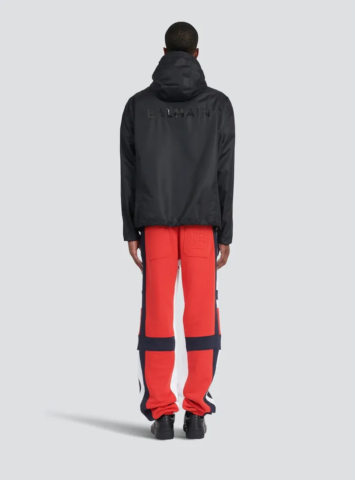 Balmain Outerwear Mens Hooded Nylon Windbreaker With Transparent Balmain Logo Black Balmain Outerwear Mens Hooded Nylon Windbreaker With Transparent Balmain Logo Black