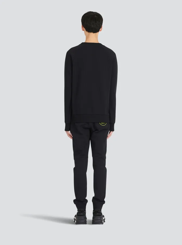 Balmain Sweatshirts Mens EcoDesigned Cotton Sweatshirt With Balmain Paris Metallic Logo Print Black Balmain Sweatshirts Mens EcoDesigned Cotton Sweatshirt With Balmain Paris Metallic Logo Print Black