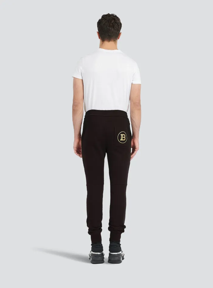 Balmain Trousers And Shorts Mens EcoDesigned Cotton Sweatpants With Balmain Logo Print Gold Balmain Trousers And Shorts Mens EcoDesigned Cotton Sweatpants With Balmain Logo Print Gold
