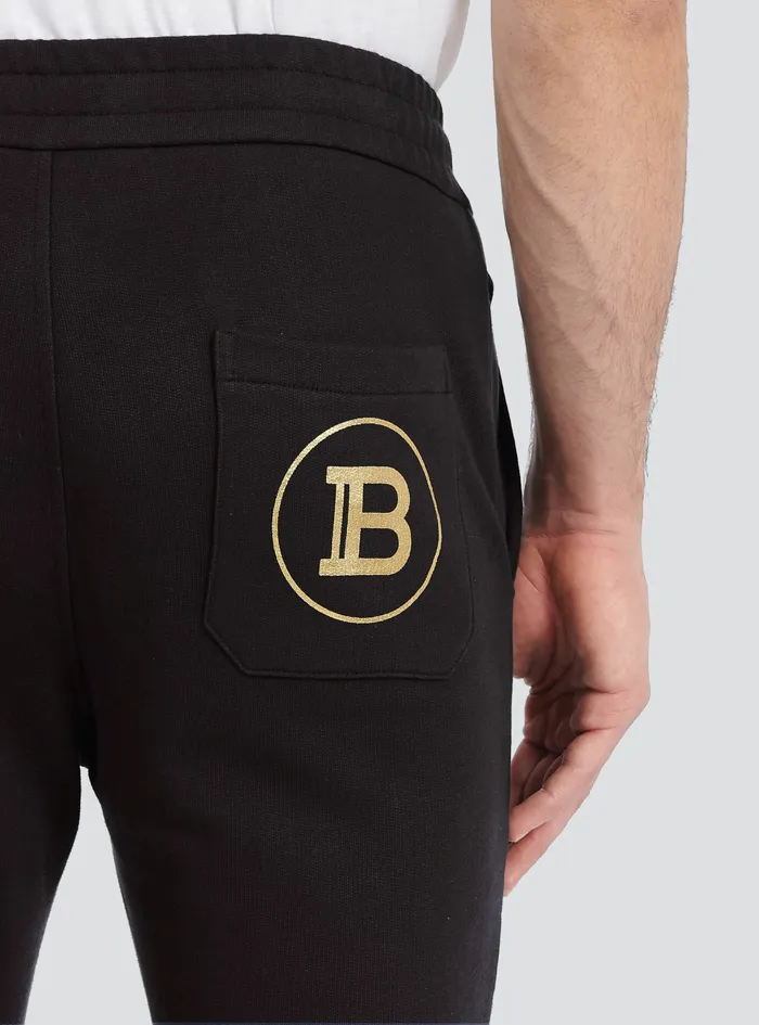 Balmain Trousers And Shorts Mens EcoDesigned Cotton Sweatpants With Balmain Logo Print Gold Balmain Trousers And Shorts Mens EcoDesigned Cotton Sweatpants With Balmain Logo Print Gold