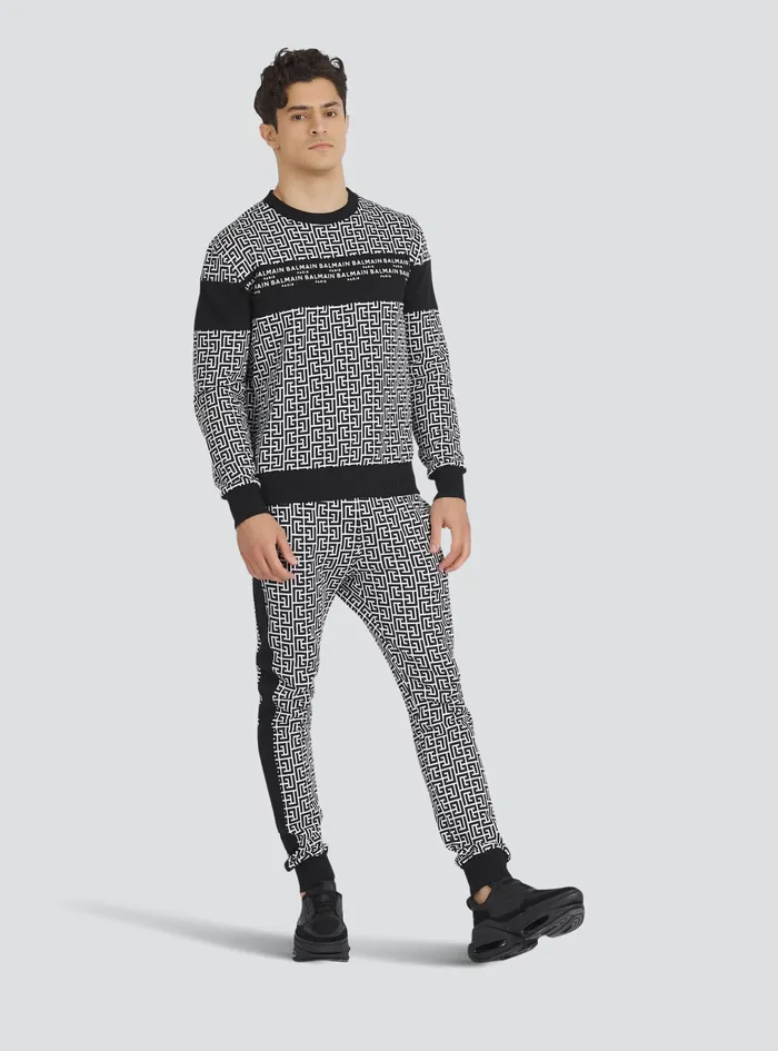 Balmain Trousers And Shorts Mens EcoDesigned Cotton Sweatpants With Balmain Monogram Print Black Balmain Trousers And Shorts Mens EcoDesigned Cotton Sweatpants With Balmain Monogram Print Black