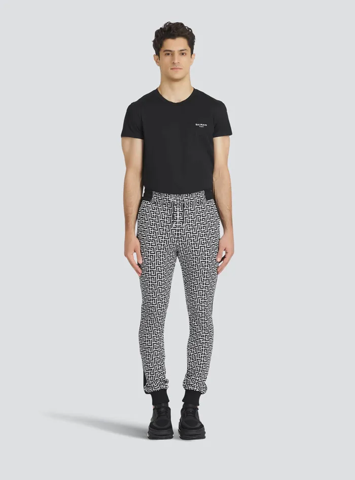Balmain Trousers And Shorts Mens EcoDesigned Cotton Sweatpants With Balmain Monogram Print Black Balmain Trousers And Shorts Mens EcoDesigned Cotton Sweatpants With Balmain Monogram Print Black